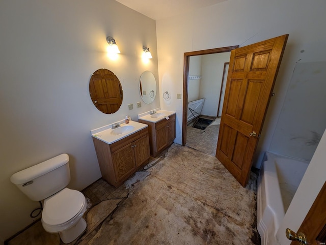 full bathroom featuring toilet, a bathing tub, two vanities, and a sink