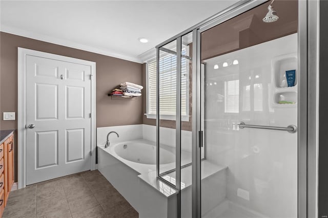 full bathroom featuring vanity, a bath, tile patterned floors, a stall shower, and crown molding