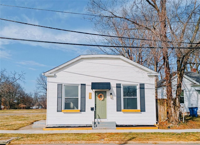 view of front of home featuring fence