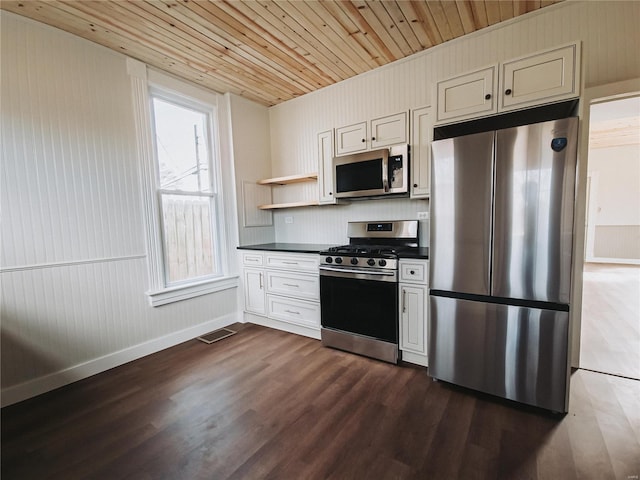 kitchen featuring open shelves, dark countertops, visible vents, appliances with stainless steel finishes, and dark wood-type flooring