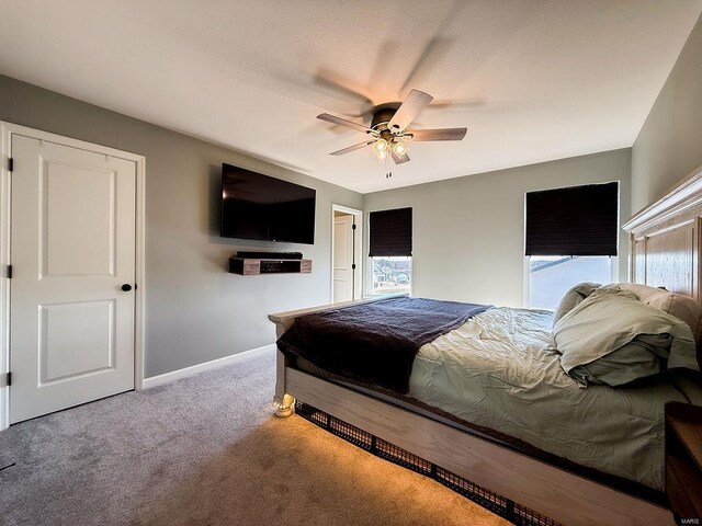 bedroom featuring carpet floors, ceiling fan, and baseboards