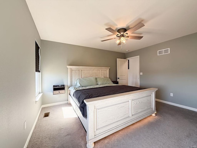 unfurnished bedroom with a ceiling fan, carpet, visible vents, and baseboards