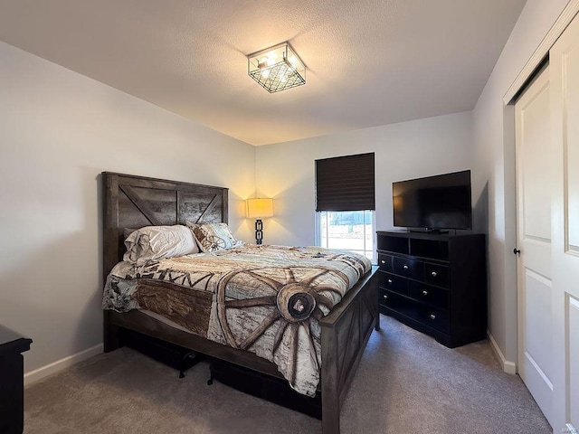 bedroom featuring carpet floors and baseboards