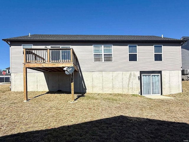 rear view of property with a wooden deck