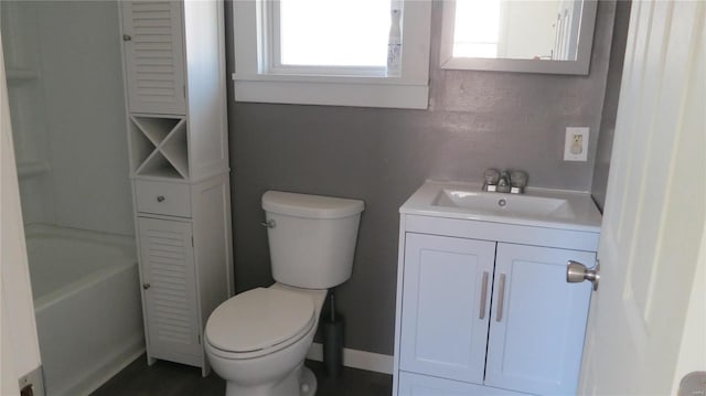 bathroom with baseboards, a shower, toilet, a bathing tub, and vanity