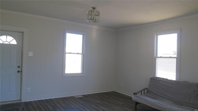 interior space with dark wood-style floors, baseboards, and crown molding