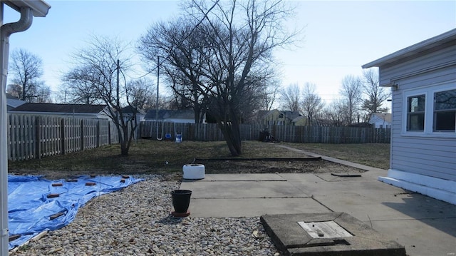 view of yard featuring a patio and a fenced backyard