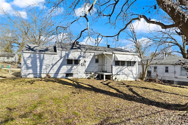 exterior space with a yard, fence, and a gate