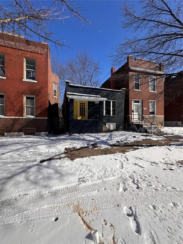 view of front of property featuring brick siding