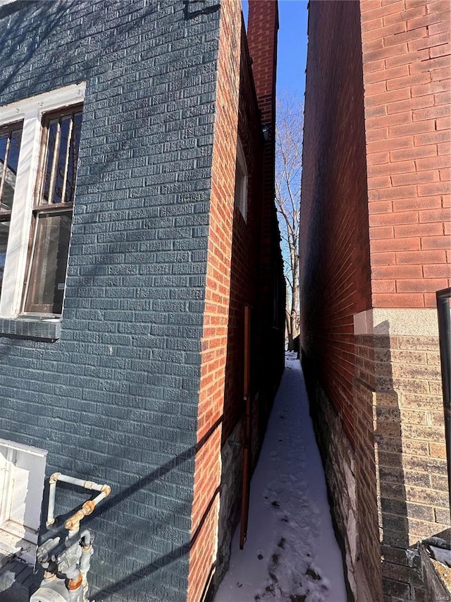 view of property exterior featuring brick siding