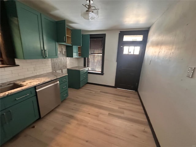 kitchen featuring light wood-style floors, dishwasher, and green cabinets