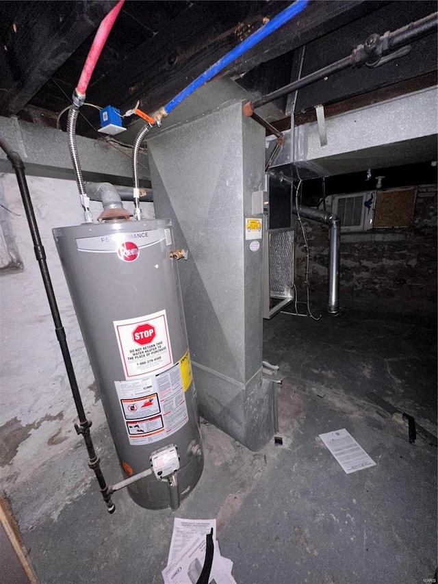 utility room featuring water heater