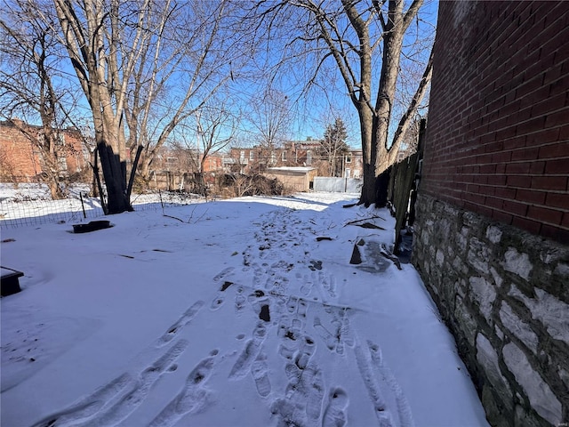 view of yard layered in snow