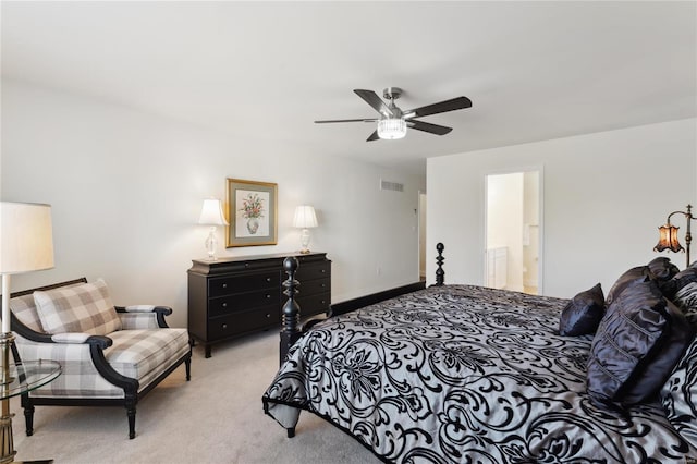 bedroom featuring light carpet, visible vents, and ceiling fan