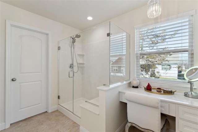 bathroom with recessed lighting and a shower stall