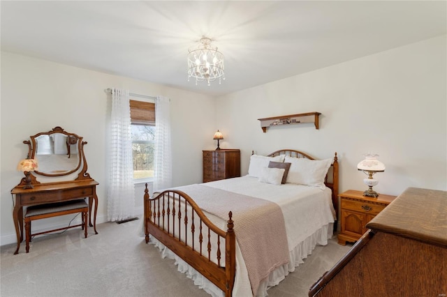 bedroom featuring a chandelier, visible vents, light carpet, and baseboards