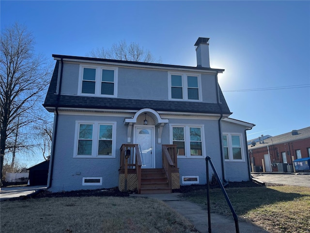 view of front of home featuring a chimney, roof with shingles, crawl space, cooling unit, and stucco siding