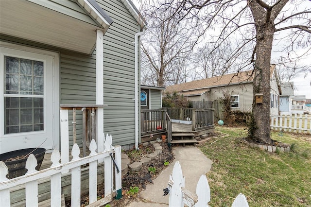 exterior space with fence and a deck