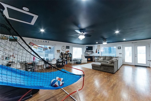 playroom featuring recessed lighting, french doors, and wood finished floors