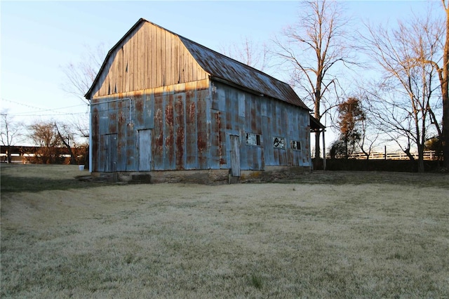 view of barn with a lawn