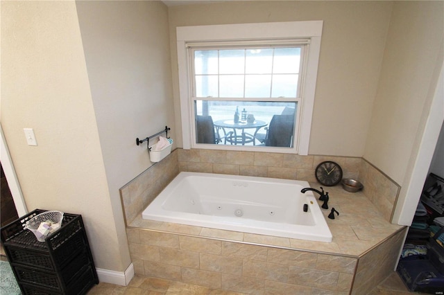 full bathroom with a whirlpool tub