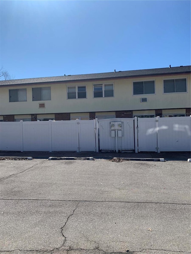 view of building exterior featuring a fenced front yard