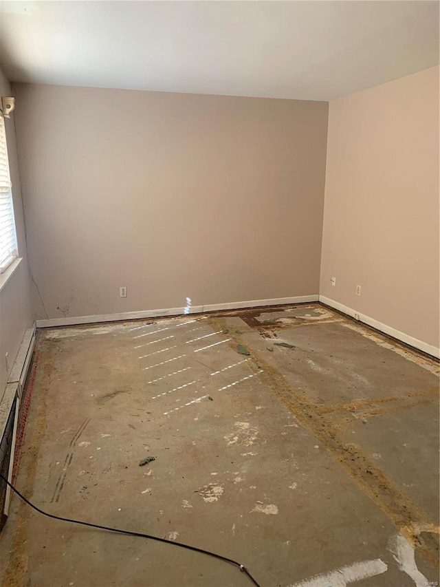 spare room featuring baseboards and baseboard heating