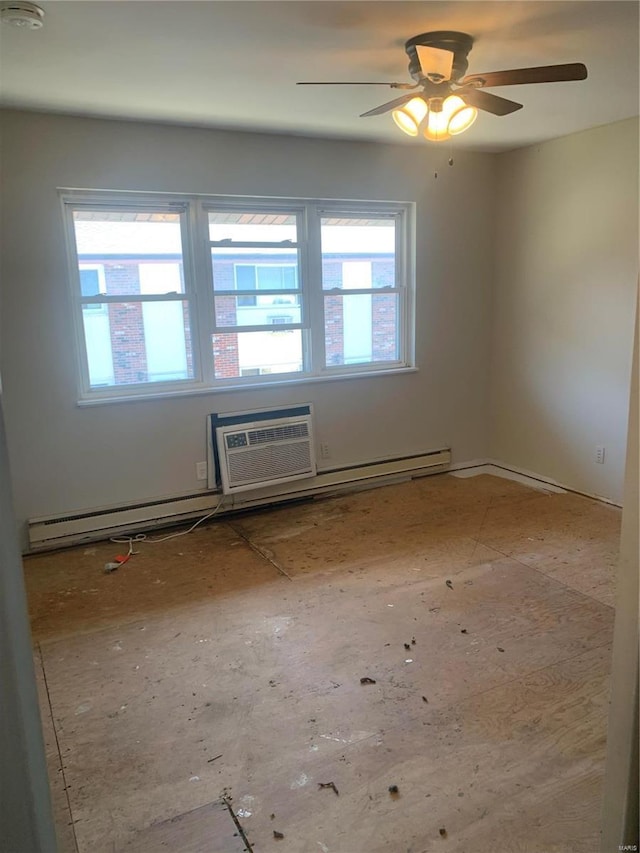 empty room featuring an AC wall unit and a ceiling fan