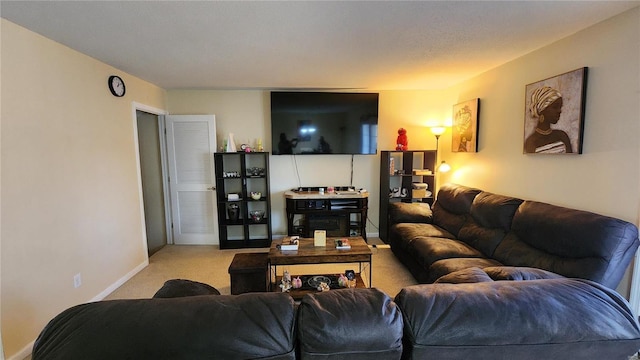 living room featuring baseboards and light colored carpet