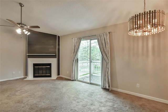 unfurnished living room featuring carpet floors, a large fireplace, baseboards, and vaulted ceiling