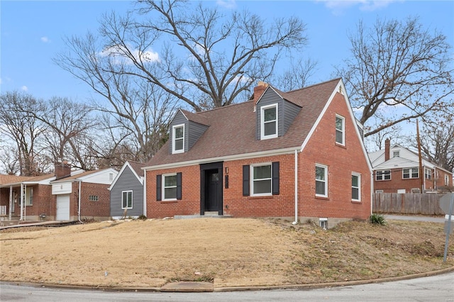 cape cod house with a shingled roof, brick siding, and fence