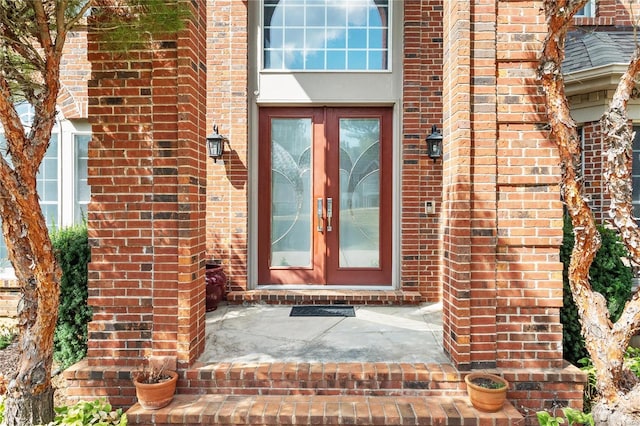 entrance to property with french doors and brick siding