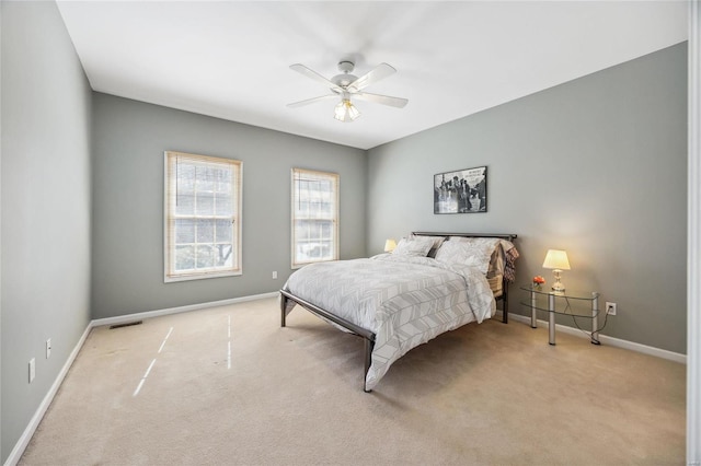 bedroom featuring ceiling fan, carpet, visible vents, and baseboards