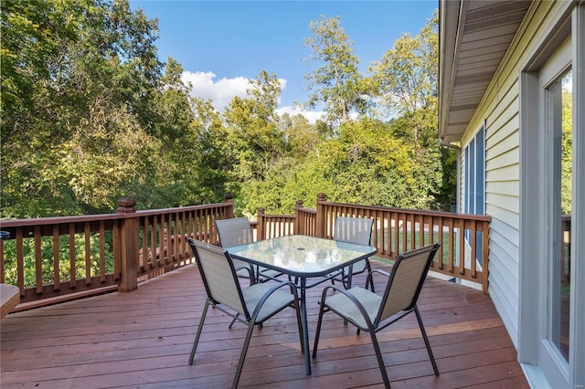 deck with outdoor dining area