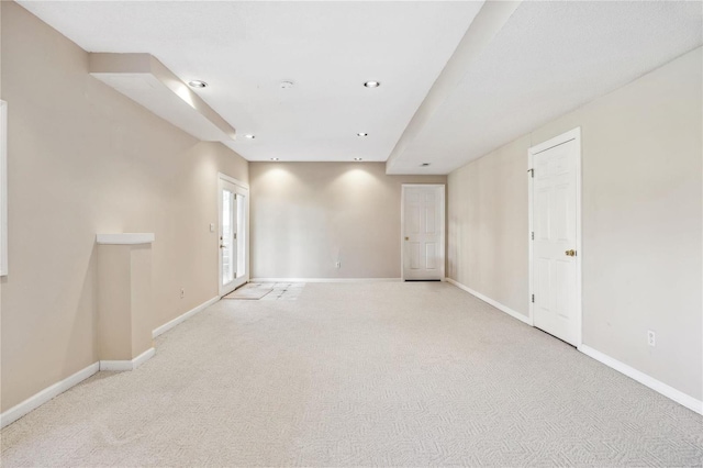 empty room featuring recessed lighting, carpet flooring, and baseboards