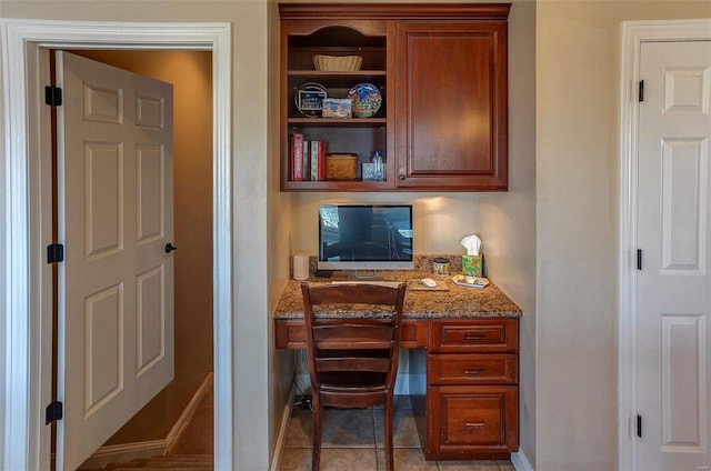 office space featuring tile patterned floors and baseboards