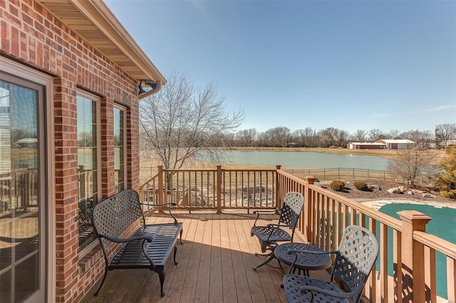 wooden deck with a water view