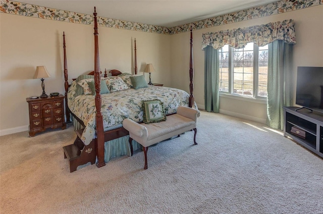 carpeted bedroom featuring baseboards