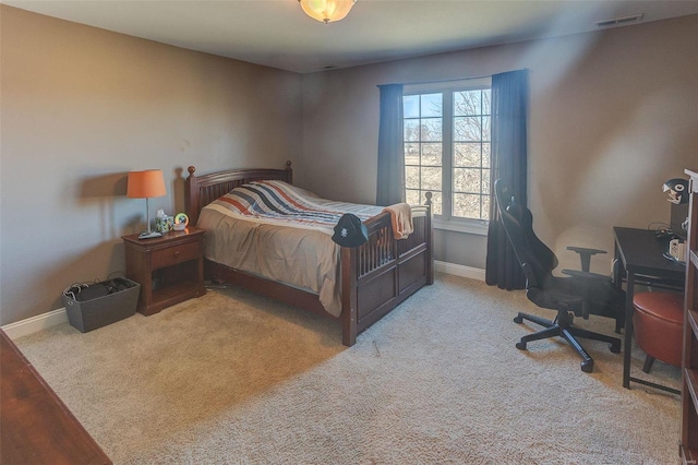 bedroom featuring carpet flooring, baseboards, and visible vents