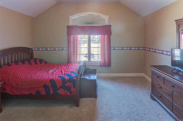 bedroom featuring baseboards, carpet floors, and vaulted ceiling