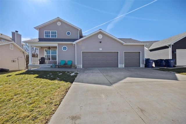 view of front of property with a front yard, covered porch, an attached garage, and concrete driveway