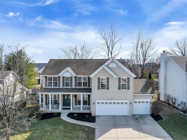 view of front of home with roof with shingles, covered porch, concrete driveway, and a front yard