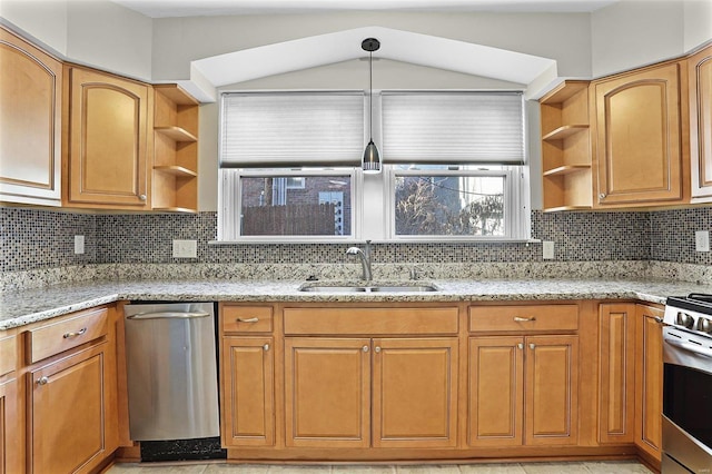 kitchen with open shelves, lofted ceiling, appliances with stainless steel finishes, a sink, and light stone countertops