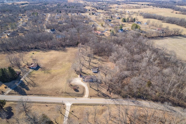 birds eye view of property featuring a rural view