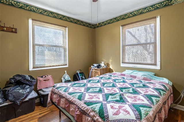 bedroom with wood finished floors