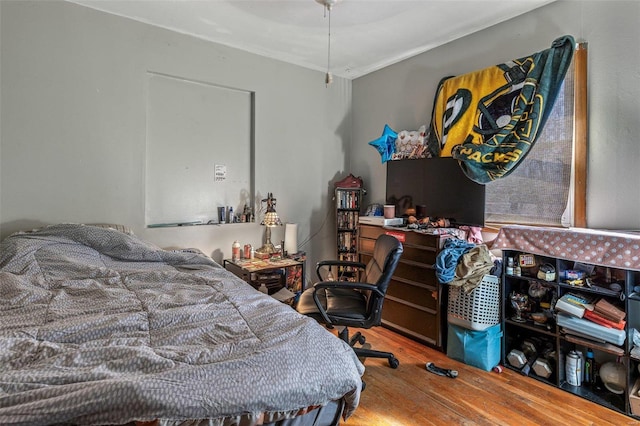 bedroom with wood finished floors