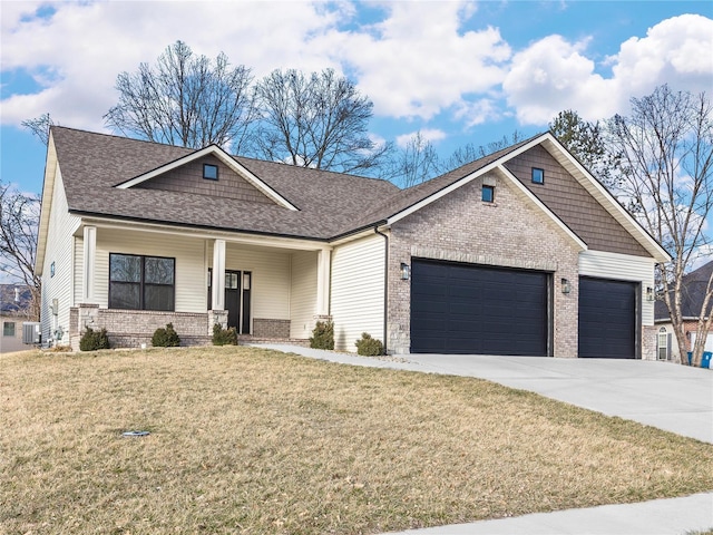 craftsman inspired home with driveway, an attached garage, a front lawn, central air condition unit, and brick siding