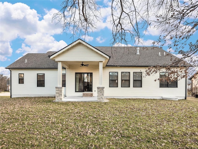 rear view of house featuring a yard, a patio, ceiling fan, and a shingled roof