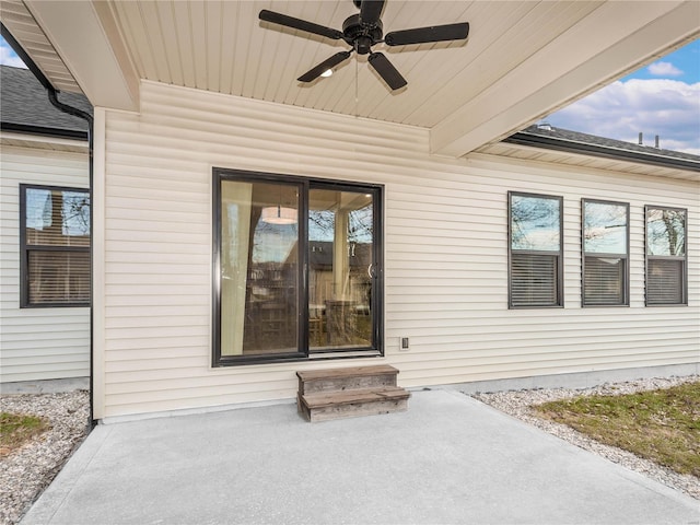 property entrance featuring a patio and a ceiling fan