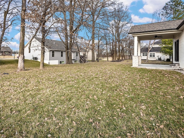 view of yard featuring a ceiling fan